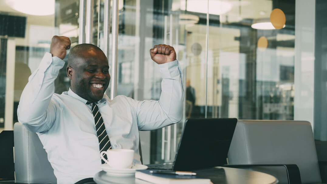 person celebrating financial milestone